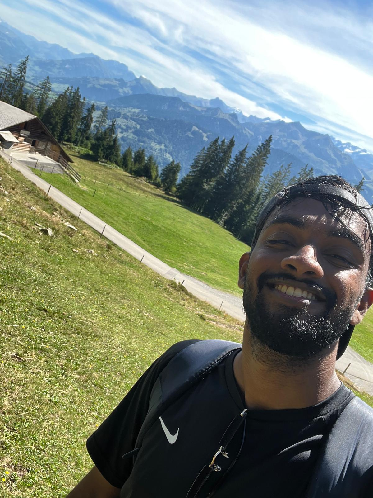 Kavisan Nagarajah outdoors in the mountains